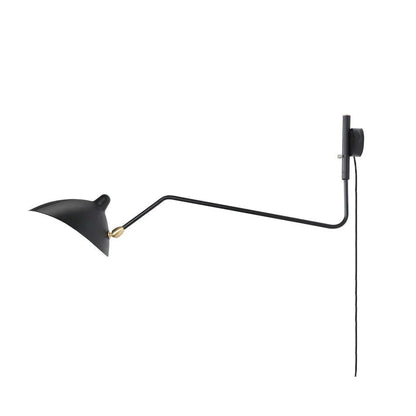 Black adjustable wall light beside sofa