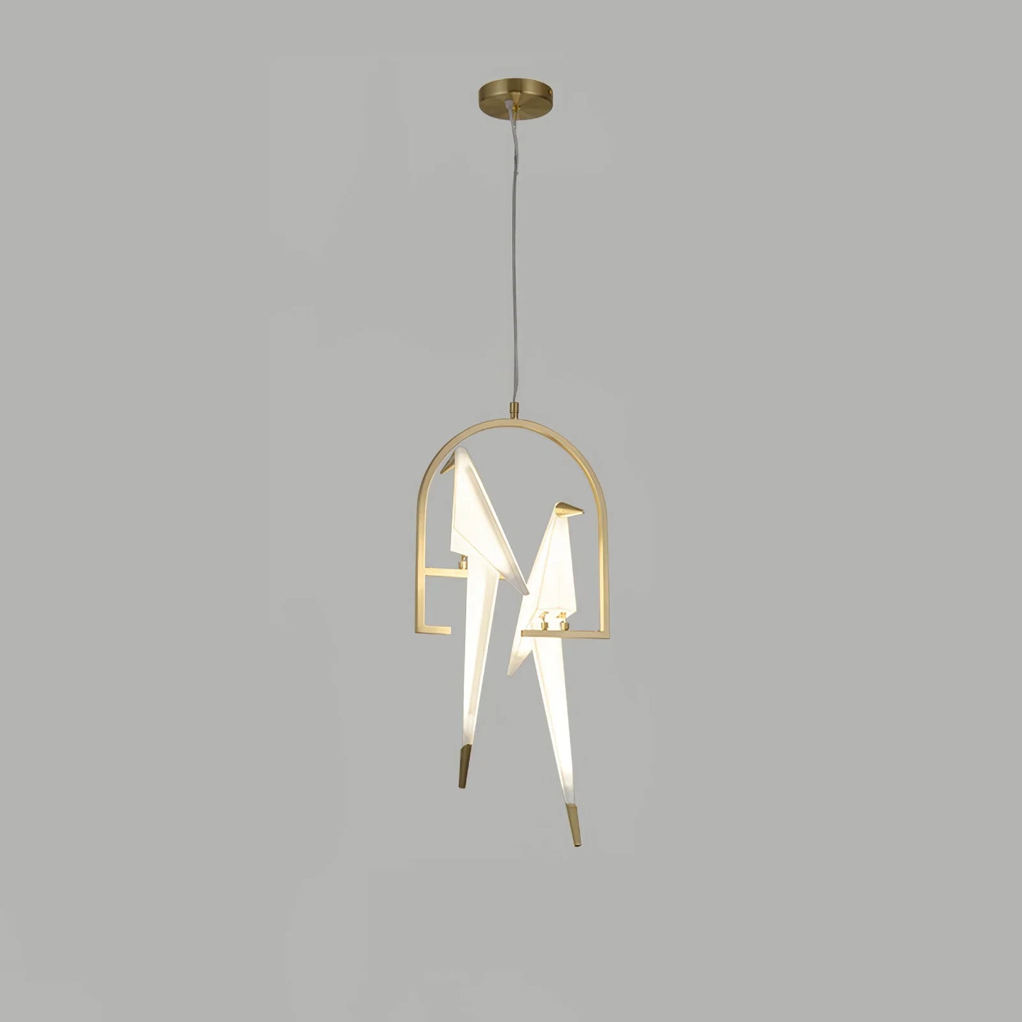Perching Bird Chandelier warm glow dining room Dubai