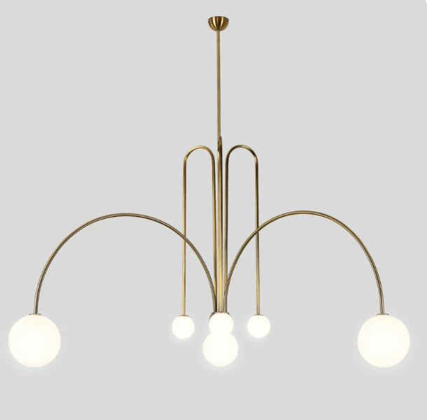 Gold frame sculptural glass chandelier in a living room
