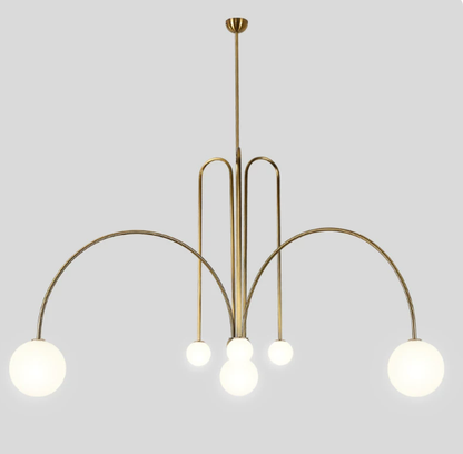 Gold frame sculptural glass chandelier in a living room
