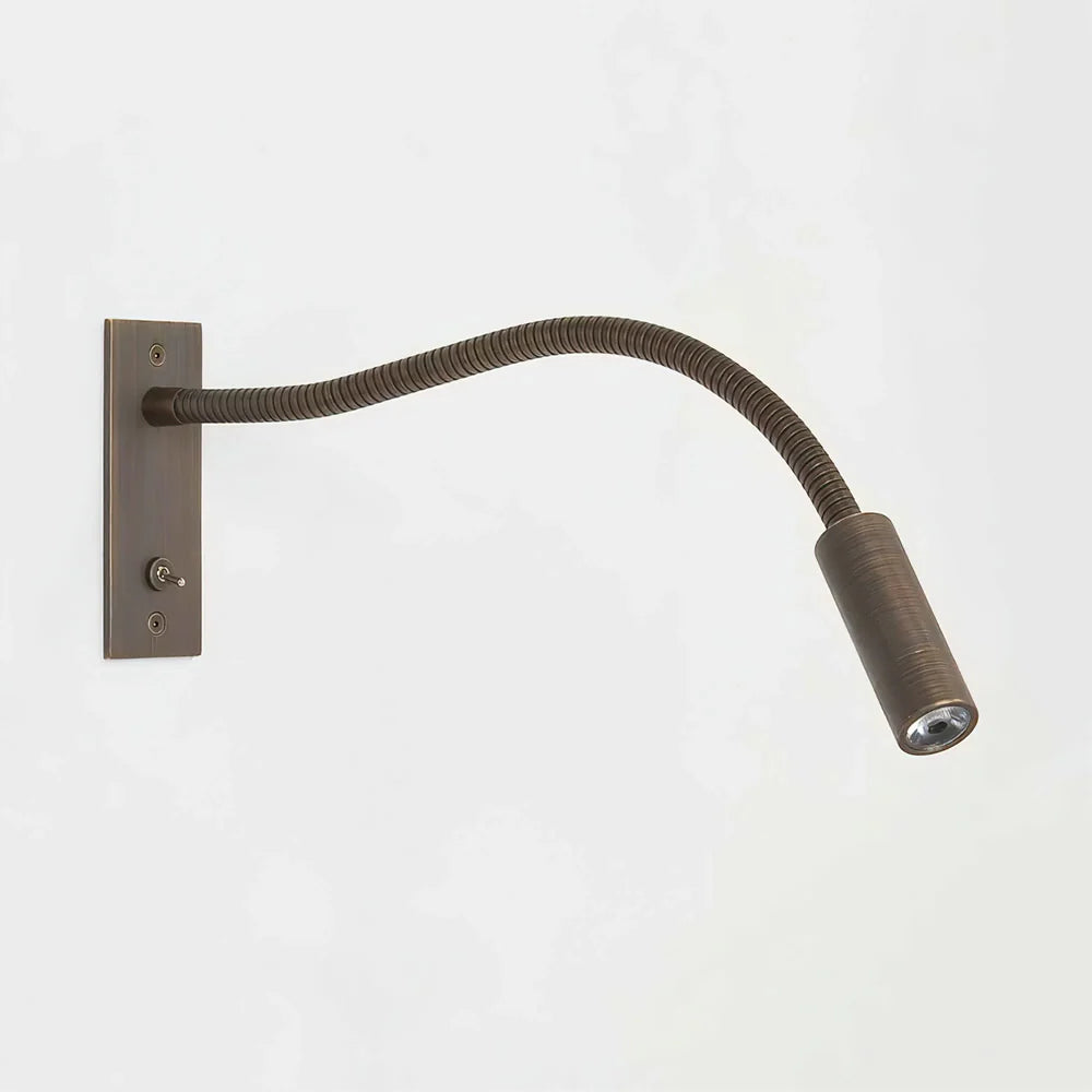 Black linear wall light for bedside accent lighting