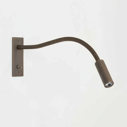 Black linear wall light for bedside accent lighting