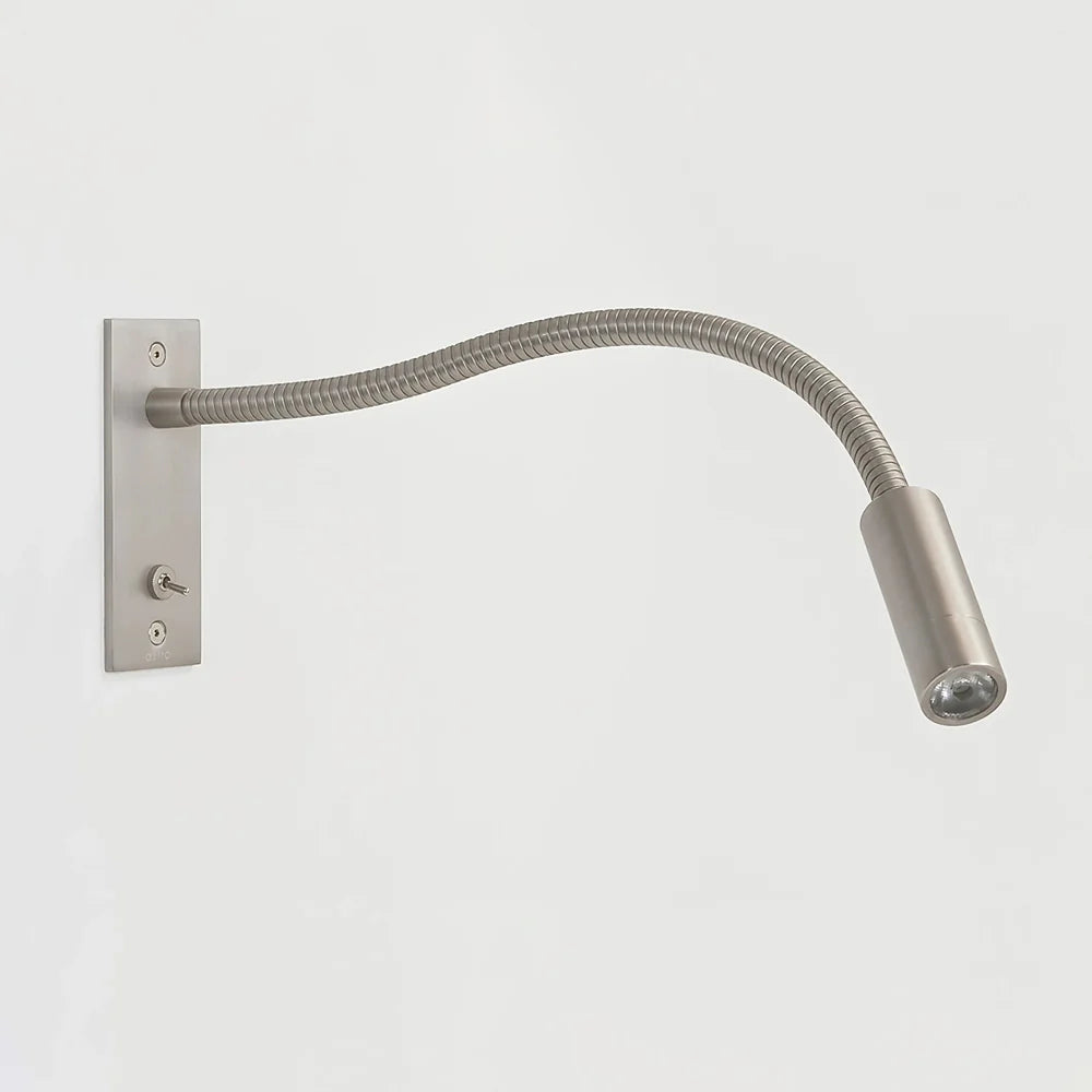 Sand nickel Art Deco wall light with warm illumination
