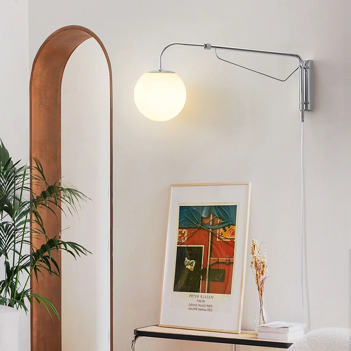 Adjustable plug-in wall light beside sofa