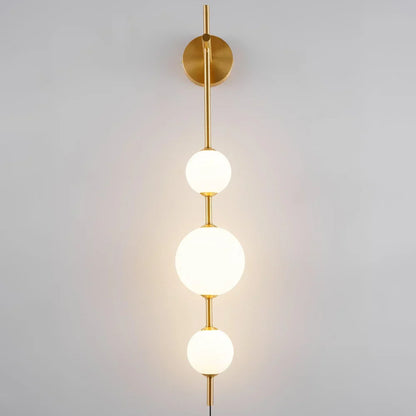 Vertical Globe Plug In Wall Lamp