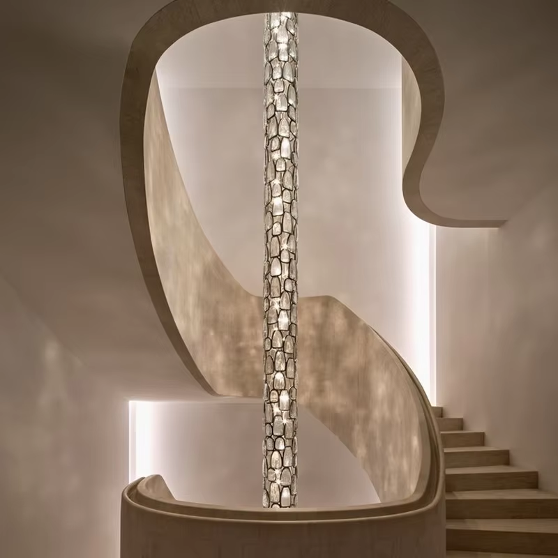 Crystal mosaic column pendant lamp installed in a modern staircase void