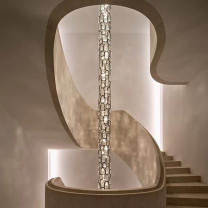 Crystal mosaic column pendant lamp installed in a modern staircase void