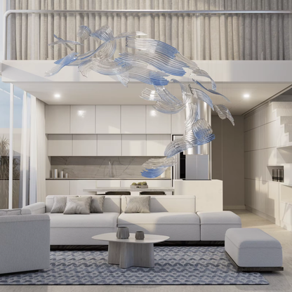 Custom brush glass chandelier above modern living room seating area