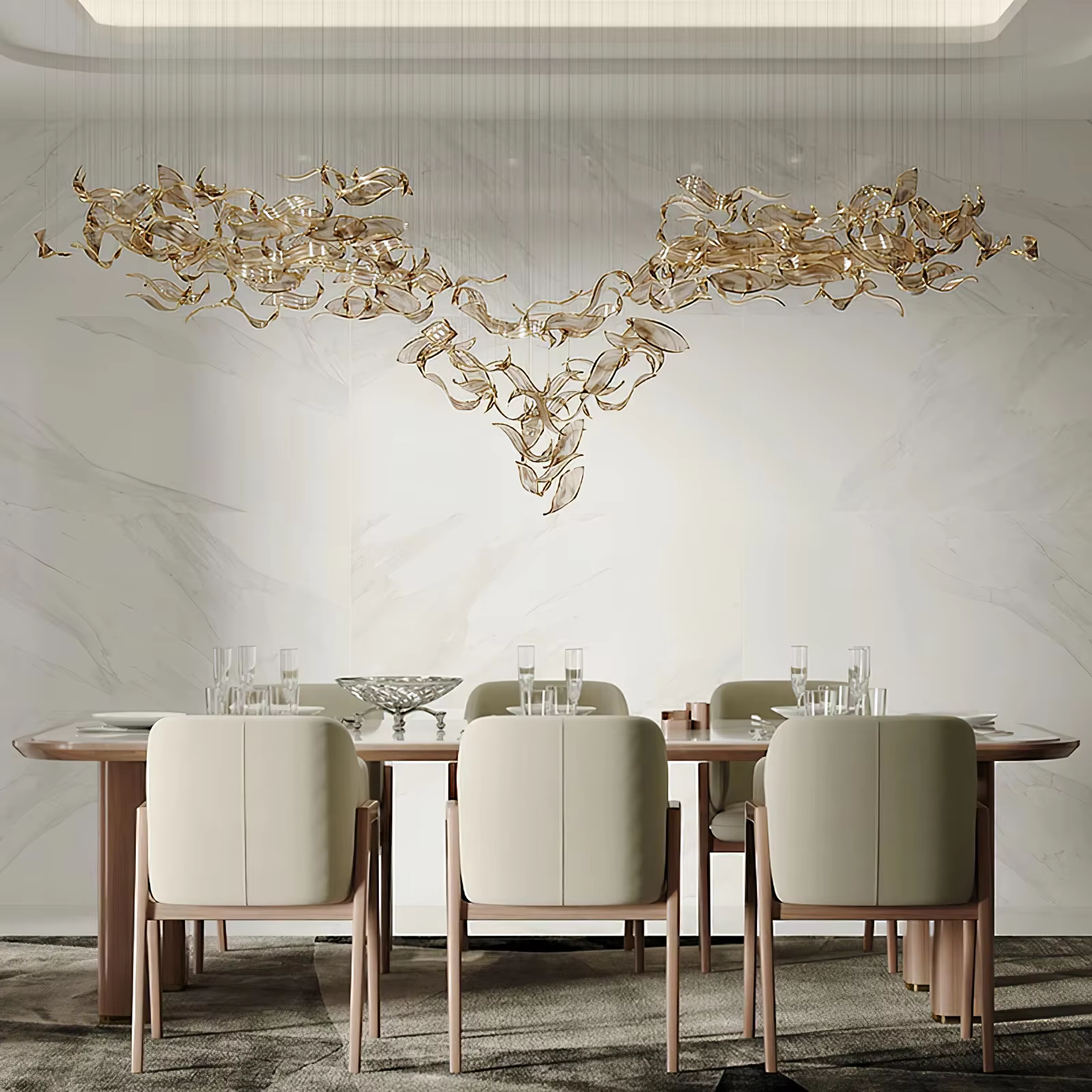 Custom gold glass leaf chandelier above dining table