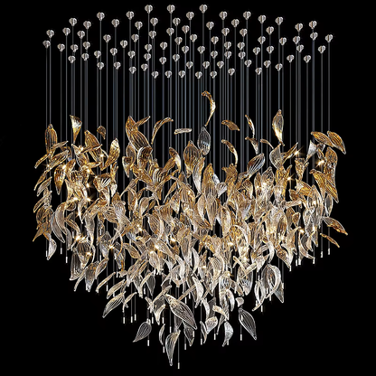 Close-up of illuminated gold and clear glass leaf chandelier